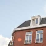 brown and white concrete building under white sky during daytime