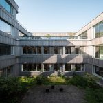 a courtyard in a building with several windows